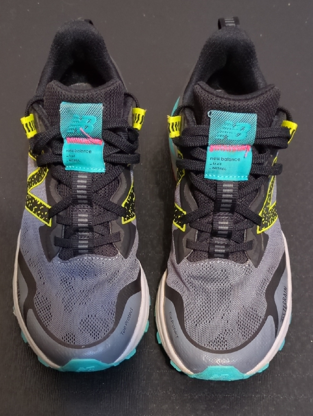 New Balance Black, Gray & Teal Trail Sneakers with Neon Yellow Highlights